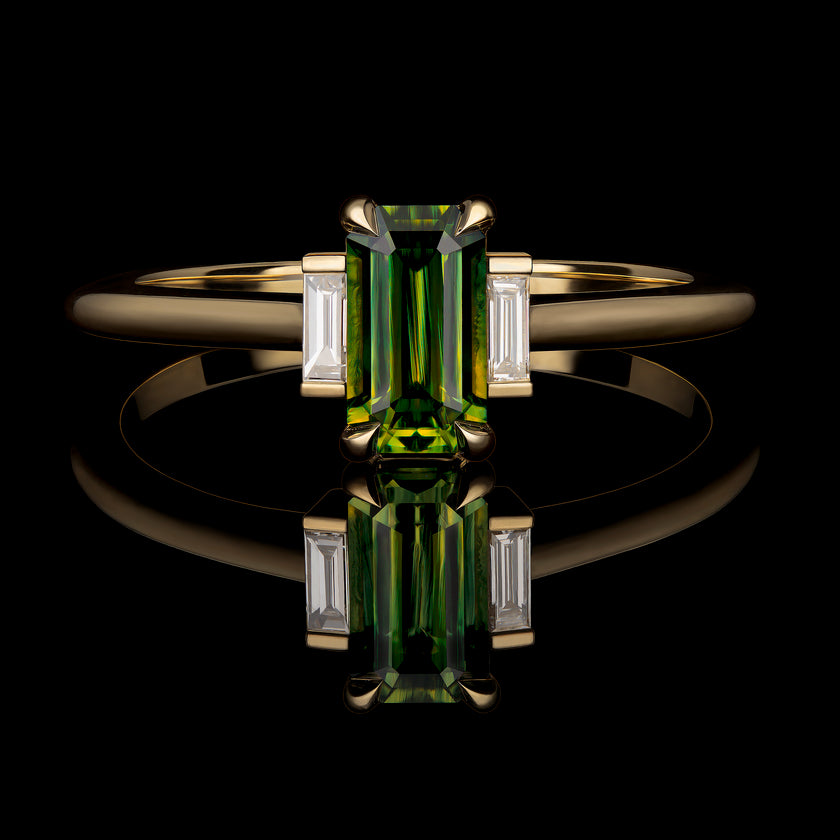 Three stone yellow gold ring, with emerald cut green parti sapphire and two smaller diamonds on each side.