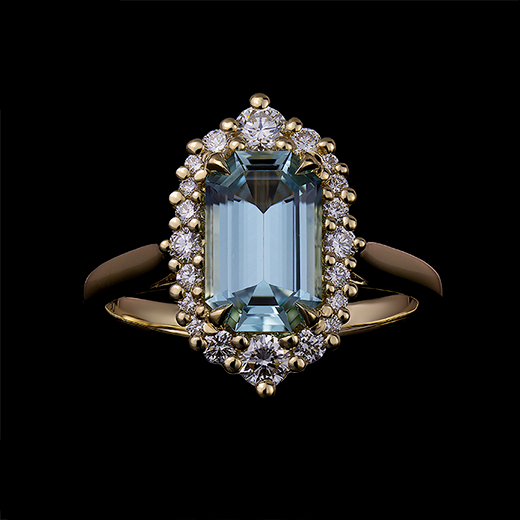 1.5 CT Emerald cut aquamarine center stone set in 4 talon claws. Surrounded by diamonds in the modern vintage halo and made in 18k yellow gold.