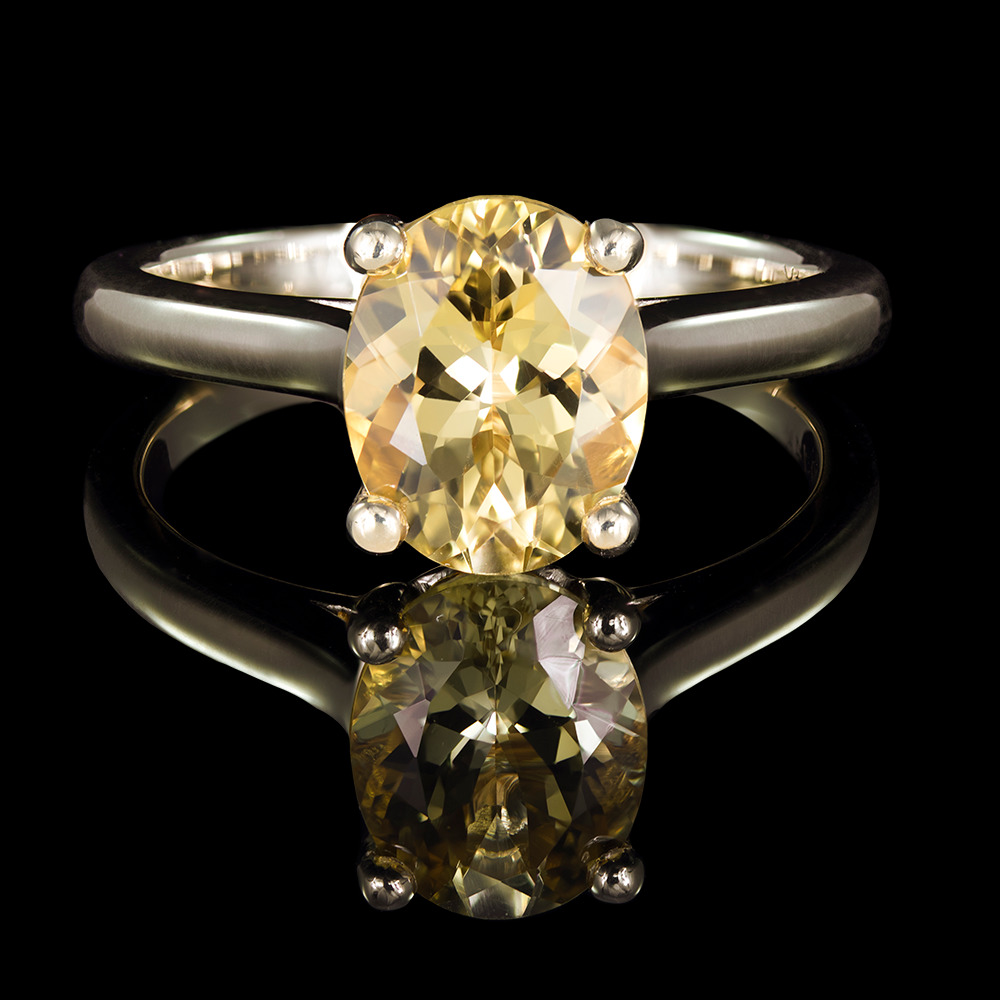 2.90 CT Oval golden topaz center stone set in 14k yellow gold mount in 4 round prongs.