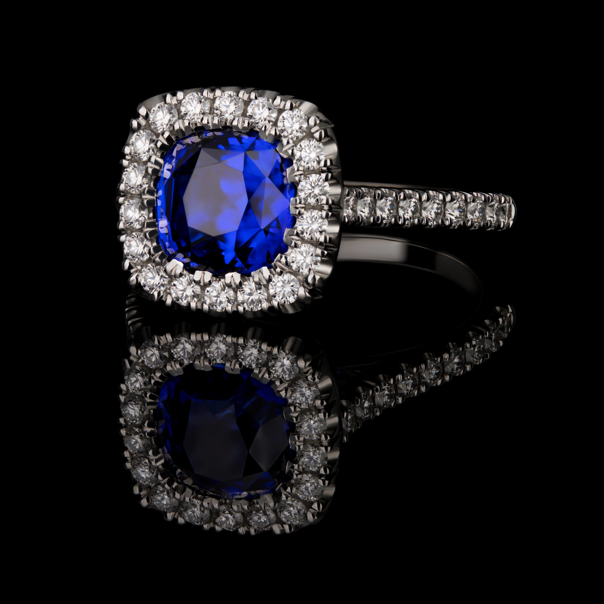 Side Facing 2.05 CT Cushion Ceylon Blue Sapphire Ring in a Clawless Halo
