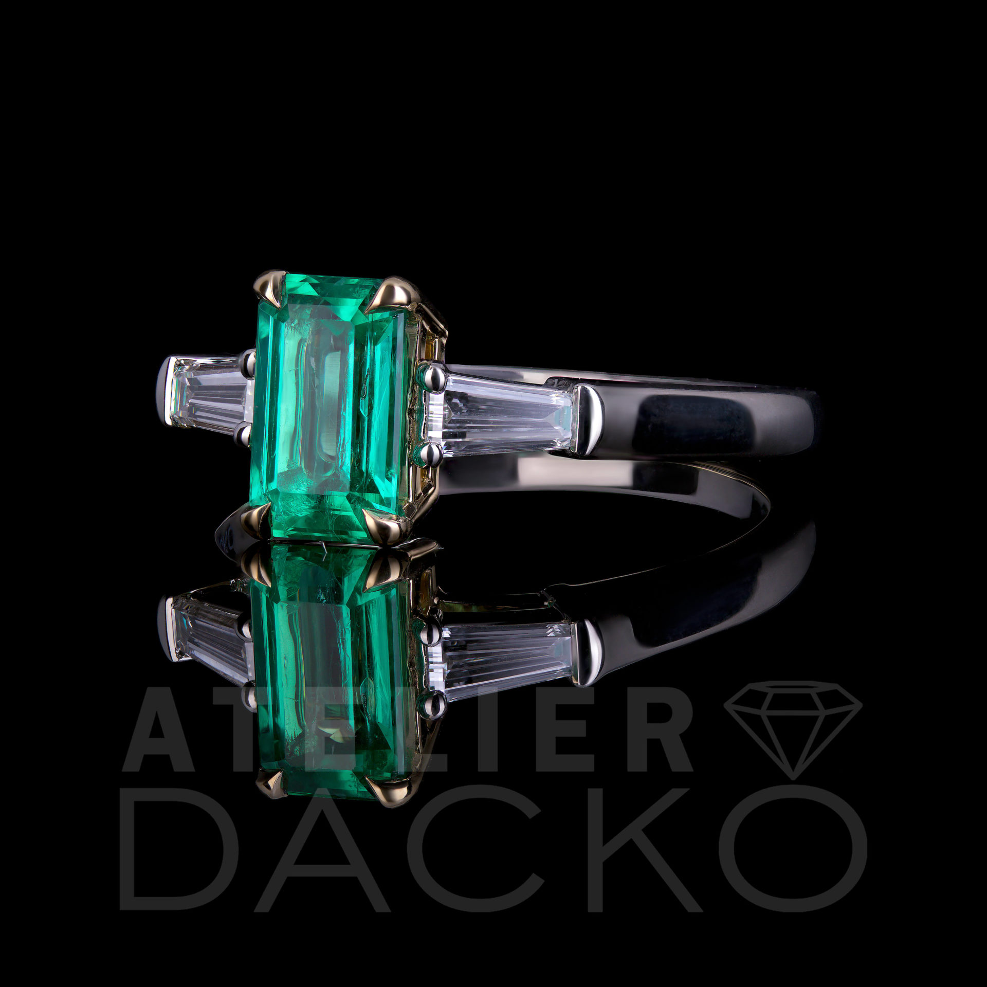 Side Facing 1.05 CT Emerald in Three Stone Ring Setting