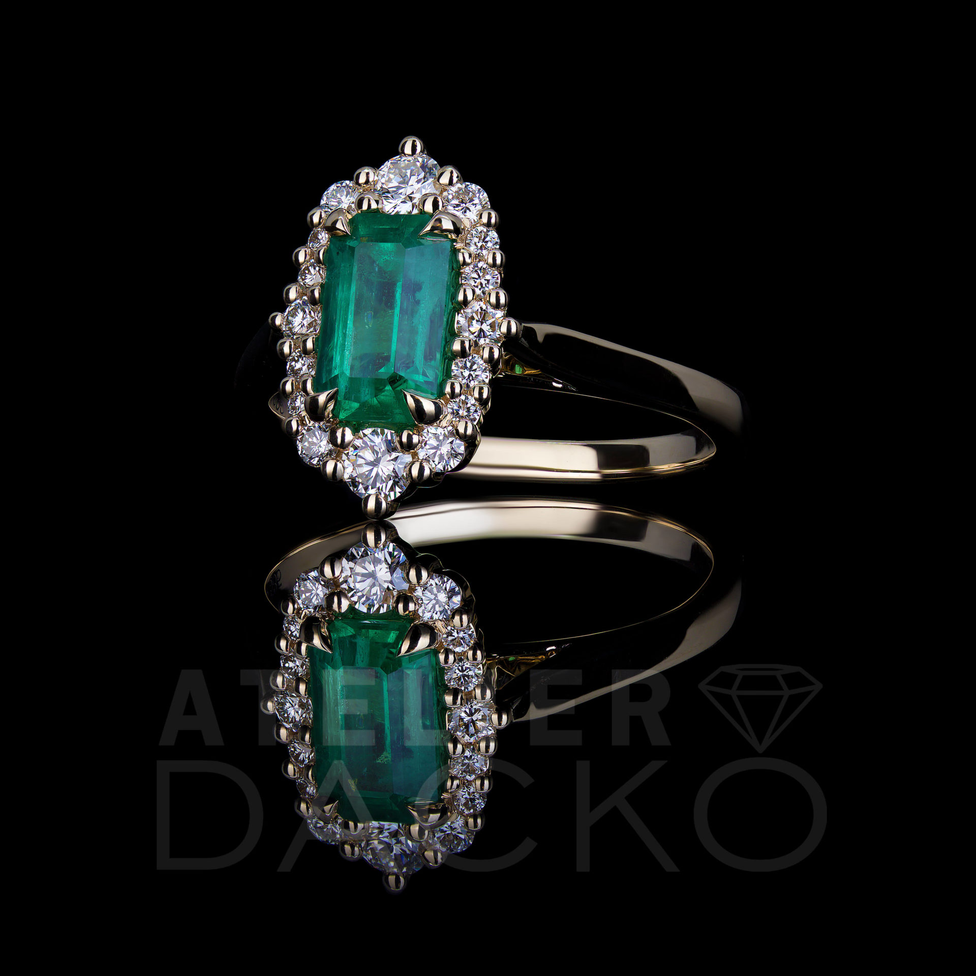 Side Facing 1.12 CT Emerald Ring with a Modern Vintage Diamond Halo
