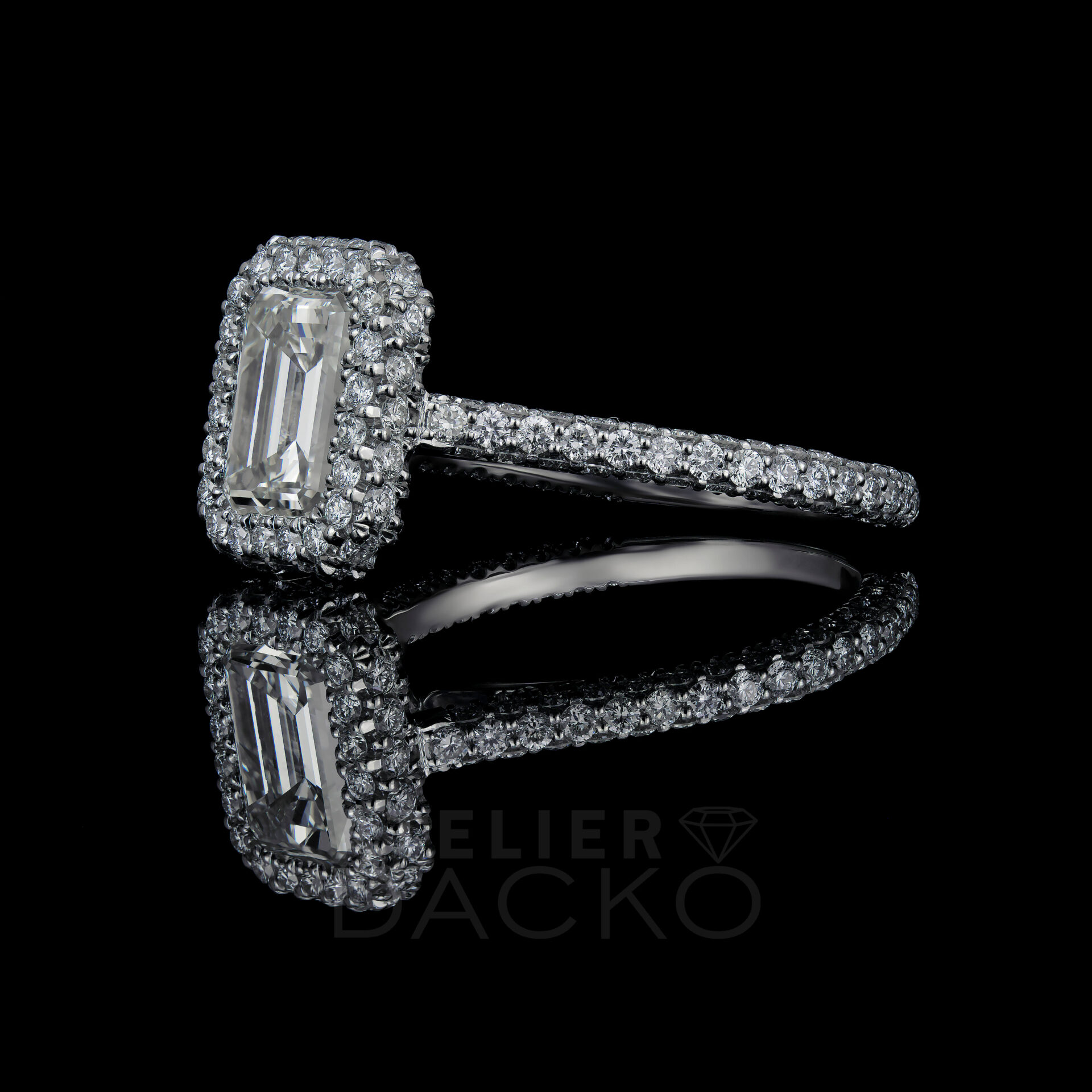 Side Facing 1.25 CT Clawless Halo Emerald Cut Engagement Ring